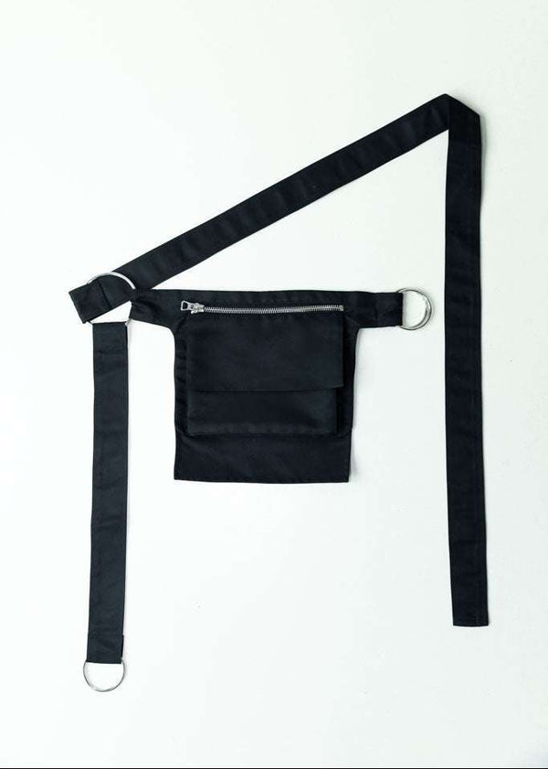 INTERNATIONAL CITIZEN.  Style: The M24 Cross Body Bag features a zipper welt pocket and patch pocket flap with adjustable ring straps. Unisex Item. Made of Italian post-consumer recycled Nylon, Obsidian Black. Spiritually Infused, Sustainable Luxury Fashion in Berlin.