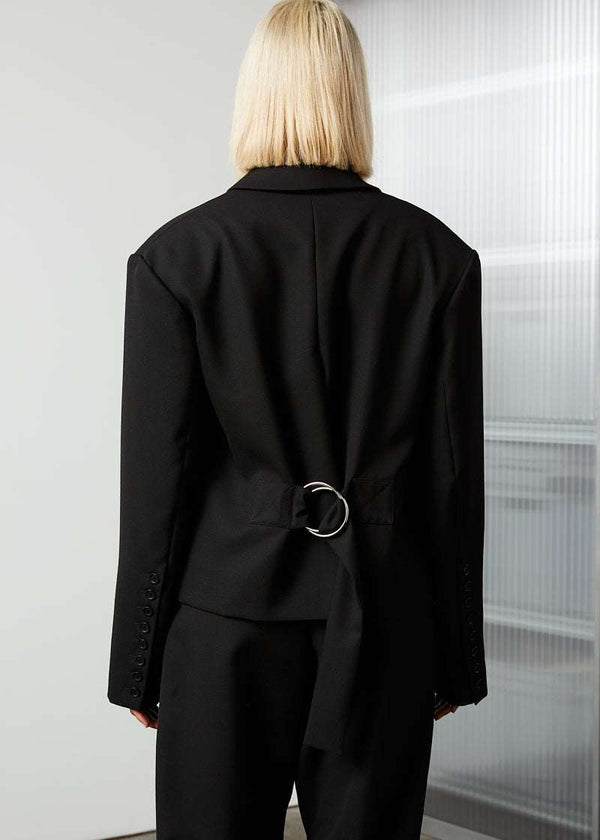 INTERNATIONAL CITIZEN.  Style: The Oversized Men’s Jacket features classic mens tailoring details within the inner construction with an oversized shape. Unisex item. Made of Italian Wool RWS, Obsidian Black. Spiritually Infused, Sustainable Luxury Fashion in Berlin. back photo. 