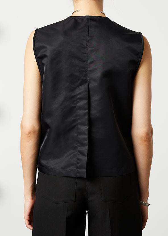 INTERNATIONAL CITIZEN.  Style: The Zipper Vest. Unisex Item. Made of Italian post consumer recycled Nylon, Obsidian Black. Spiritually Infused, Sustainable Luxury Fashion in Berlin. Back photo.