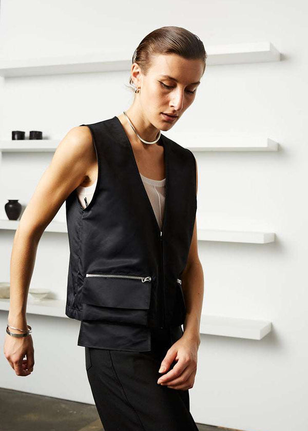 INTERNATIONAL CITIZEN.  Style: The Zipper Vest is water repellent and has double pocket detailing with both a patch pocket flat and zipper welt with exposed pocket bags. Unisex Item.. Made of Italian post consumer recycled Nylon, Obsidian Black. Spiritually Infused, Sustainable Luxury Fashion in Berlin. Front photo.