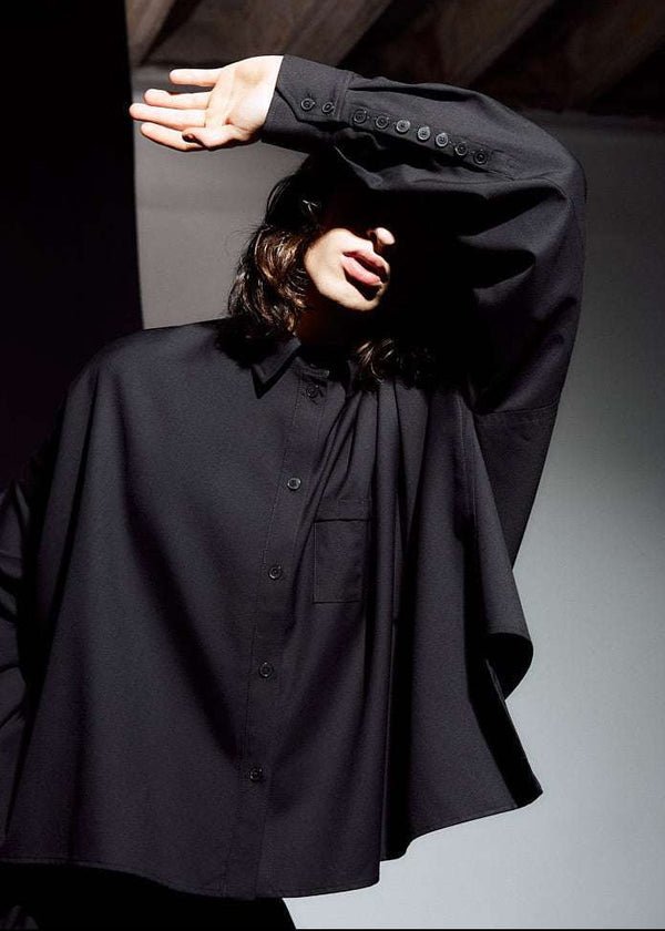 INTERNATIONAL CITIZEN.  Style: The Cubism Shirt is a 3-dimensional cube tilted on its axes to create a boxy minimal front body. Unisex Item. Close up front photo. Made of Italian RWS Wool, Obsidian Black. Spiritually Infused, Sustainable Luxury Fashion in Berlin.