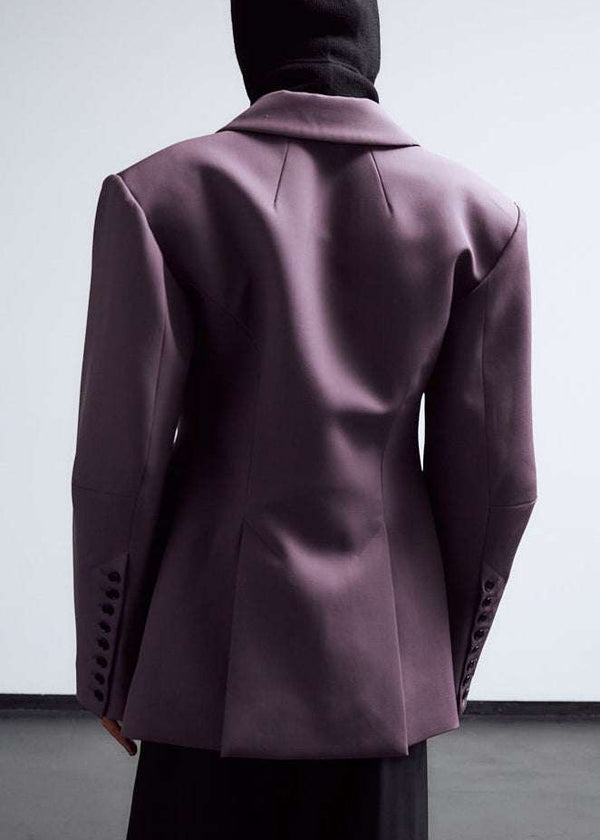 INTERNATIONAL CITIZEN.  Style: The Hourglass Jacket is named after its perfected silhouette, shaped with a nipped waist. Unisex Item. Close up of back body male. Made of Italian Wool, certified RWS, Amethyst Purple. Spiritually Infused, Sustainable Luxury Fashion in Berlin.
