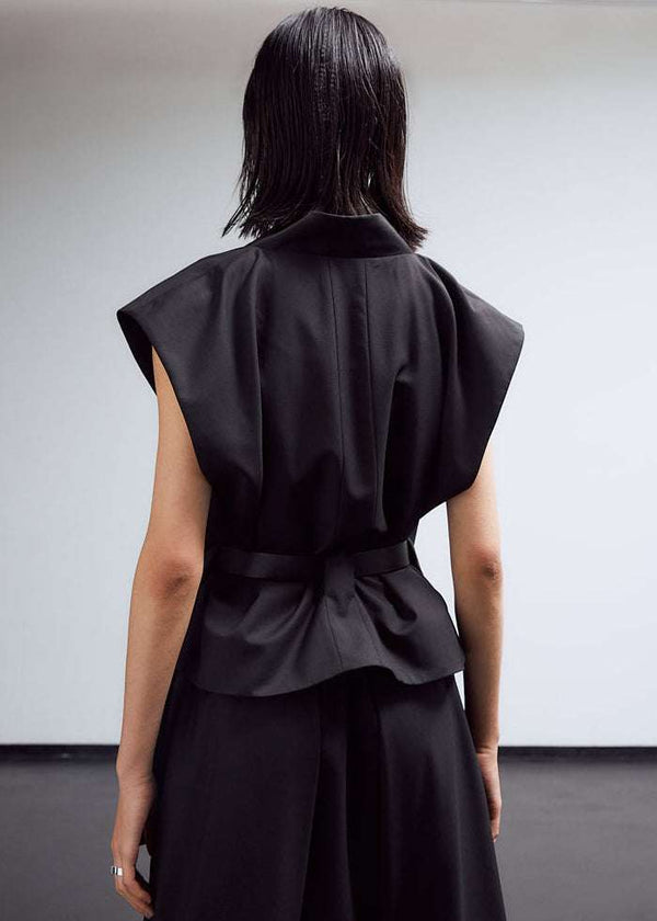 INTERNATIONAL CITIZEN.  Style: The Kimono Vest has a longer front body with inseam pockets and short back body. Unisex Item. Back body photo. Made of Italian Wool, certified (RWS) Responsible Wool Standard, Obsidian Black. Spiritually Infused, Sustainable Luxury Fashion in Berlin.