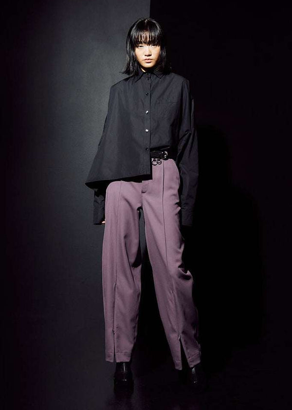 INTERNATIONAL CITIZEN.  Style: The Cubism Shirt is a 3-dimensional cube tilted on its axes to create a boxy minimal front body and a utility pen pocket on the chest. Unisex Item. Full body back view. Made of Italian Organic Cotton, Obsidian Black. Spiritually Infused, Sustainable Luxury Fashion in Berlin.
