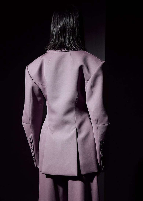 INTERNATIONAL CITIZEN.  Style: The Hourglass Jacket is named after its perfected silhouette, shaped with a nipped waist. Close up back photo. Unisex Item. Made of Italian Wool, certified RWS, Amethyst Purple. Spiritually Infused, Sustainable Luxury Fashion in Berlin.