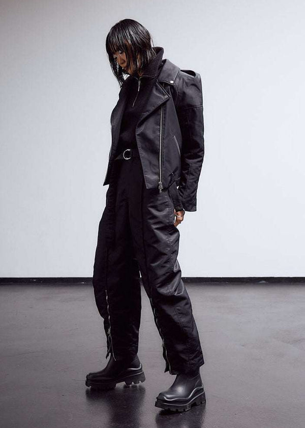 INTERNATIONAL CITIZEN.  Style: The M23 Moto Jacket has classic moto detailing. Unisex Item. Full front photo. Made of Italian post-consumer recycled Nylon, Obsidian Black. Spiritually Infused, Sustainable Luxury Fashion in Berlin.