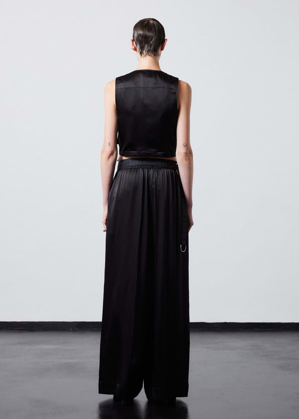 INTERNATIONAL CITIZEN.  Style: The Mini Zipper Vest. Made of Organic Silk, Obsidian Black. Spiritually Infused, Sustainable Luxury Fashion in Berlin. Full body back photo.