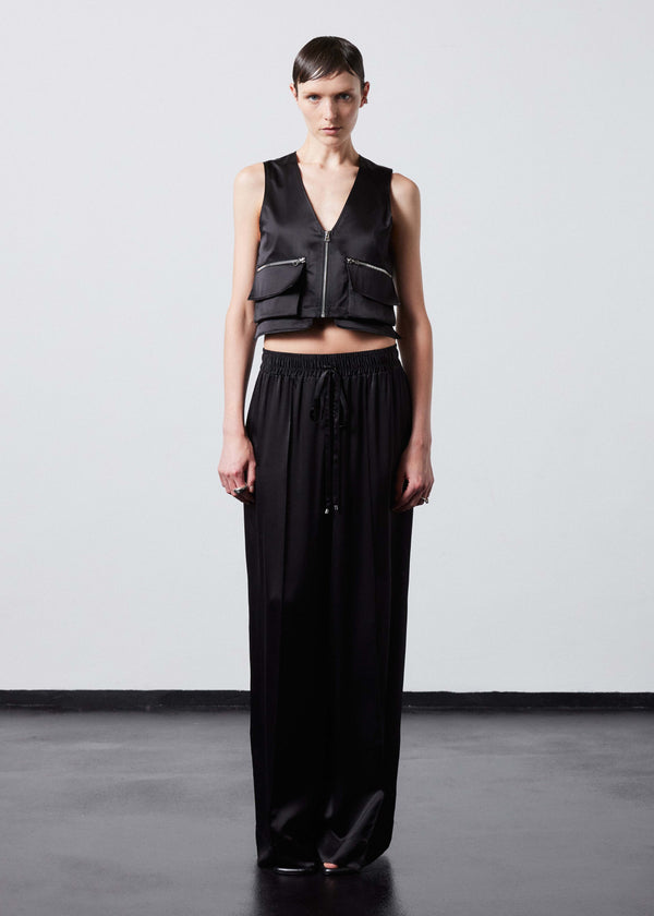 INTERNATIONAL CITIZEN.  Style: The Mini Zipper Vest. Made of Organic Silk, Obsidian Black. Spiritually Infused, Sustainable Luxury Fashion in Berlin. Full front photo.