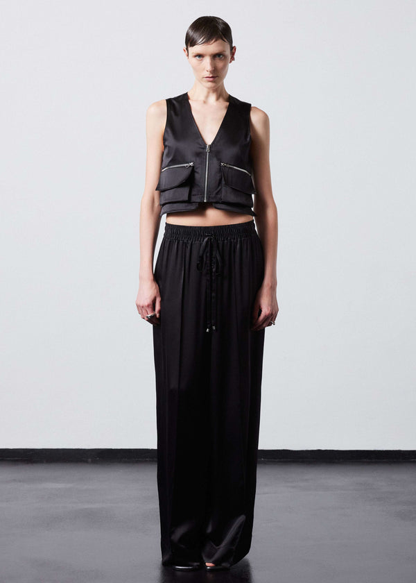 INTERNATIONAL CITIZEN.  Style: The Arcana Pant. Style has a relaxed fit with front pin-tucks and excessive volume eased into the waistband. Unisex Item. The pants are made of Italian organic silk in Obsidian Black. Spiritually Infused, Sustainable Luxury Fashion in Berlin.