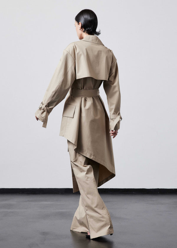 INTERNATIONAL CITIZEN.  Style: The Eclipse Jacket. A unisex, asymmetrical along the hemline and oversized with soft shoulder pads for collapsed structure. Side back view. Made of Italian Organic Cotton, Dune. Spiritually Infused, Sustainable Luxury Fashion in Berlin.