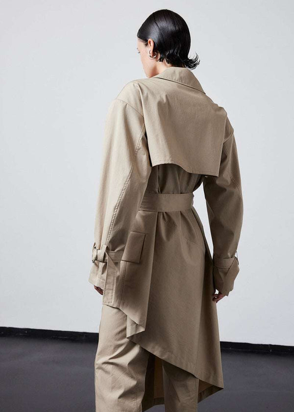 INTERNATIONAL CITIZEN.  Style: The Eclipse Jacket. A unisex, asymmetrical along the hemline and oversized with soft shoulder pads for collapsed structure. Close up back view.  Made of Italian Organic Cotton, Dune. Spiritually Infused, Sustainable Luxury Fashion in Berlin.