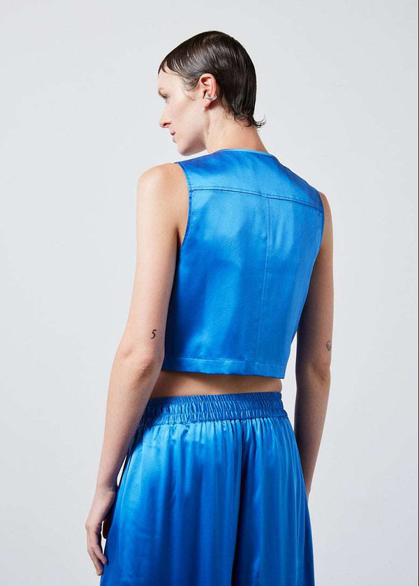 INTERNATIONAL CITIZEN.  Style: The Mini Zipper Vest. Made of Organic Silk, Azurite Blue. Spiritually Infused, Sustainable Luxury Fashion in Berlin. Back photo. 