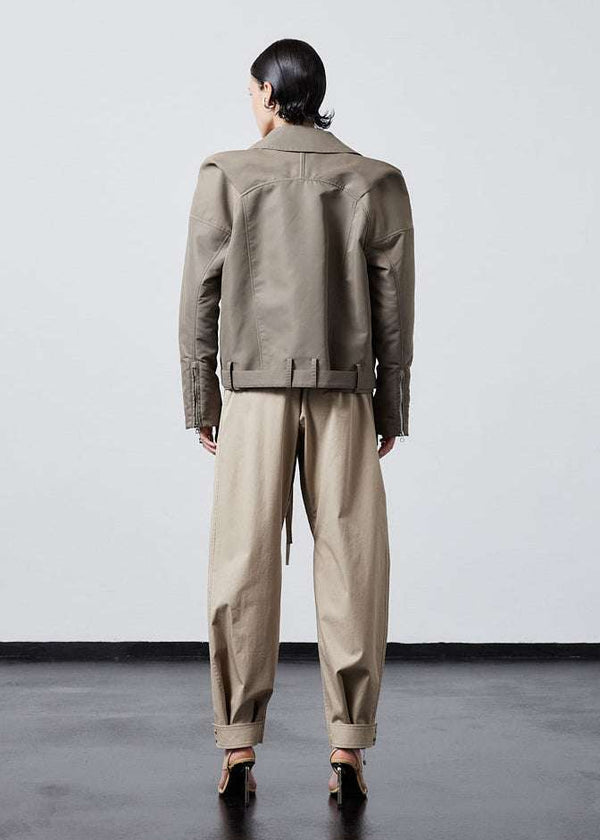 INTERNATIONAL CITIZEN.  Style: The M23 Moto Jacket has classic moto detailing and an innovative drape at the back shoulder creating a soft strength in the silhouette. Unisex Item. Full back view. Made of Italian post-consumer recycled Nylon, Dune. Spiritually Infused, Sustainable Luxury Fashion in Berlin.