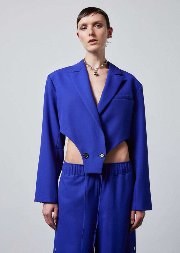 INTERNATIONAL CITIZEN.  Style: The French-Cut Jacket is oversized in the fit with a high french-cut hemline. Double breasted with ties at the front and back that function like a body suit. Unisex item. Made of Italian Wool, Lapis Lazuli blue. Spiritually Infused, Sustainable Luxury Fashion in Berlin.