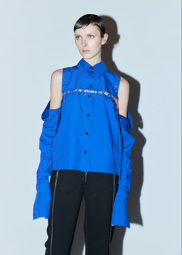 INTERNATIONAL CITIZEN.  Style: The Stitch Shirt , worn unstitched. Made of Italian Organic Cotton, Lapis Lazuli Blue. Spiritually Infused, Sustainable Luxury Fashion in Berlin. Front photo.
