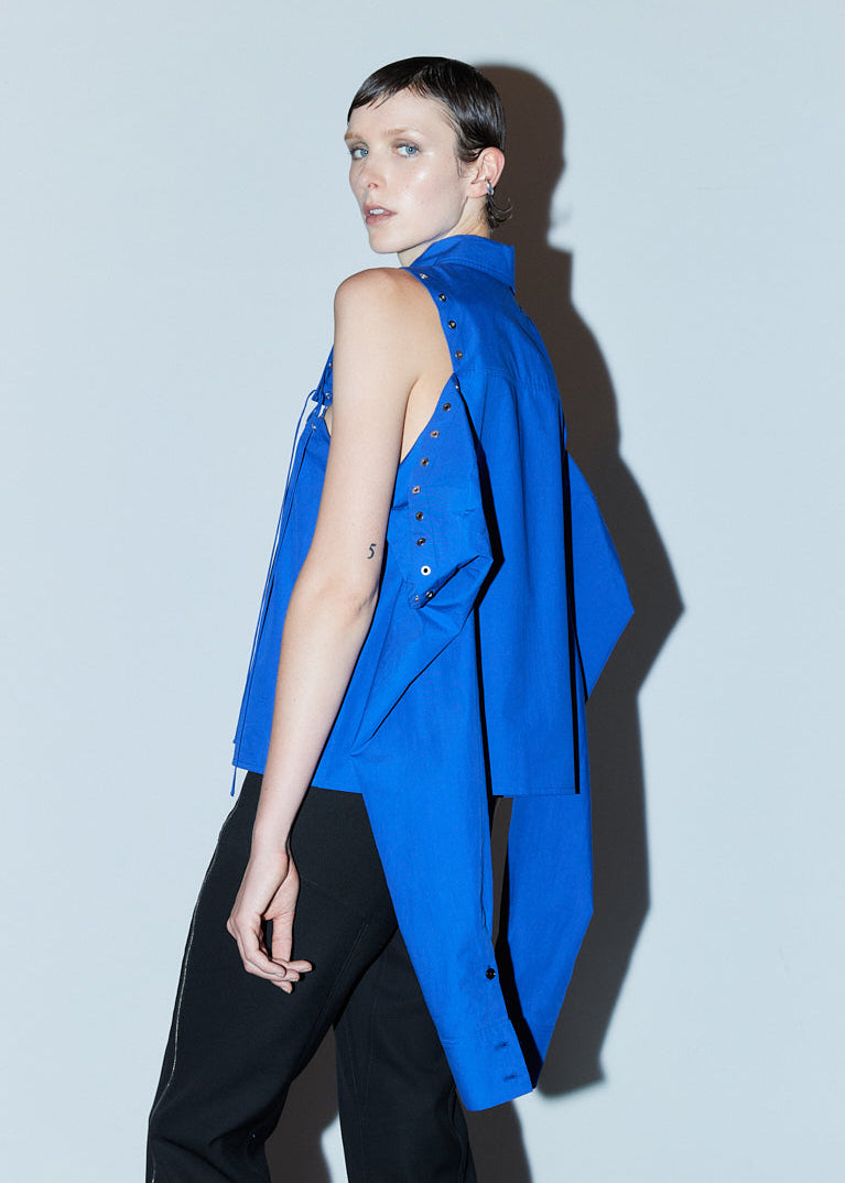 INTERNATIONAL CITIZEN.  Style: The Stitch Shirt. Side view, unstitched. Made of Italian Organic Cotton, Lapis Lazuli Blue. Spiritually Infused, Sustainable Luxury Fashion in Berlin. Front photo.