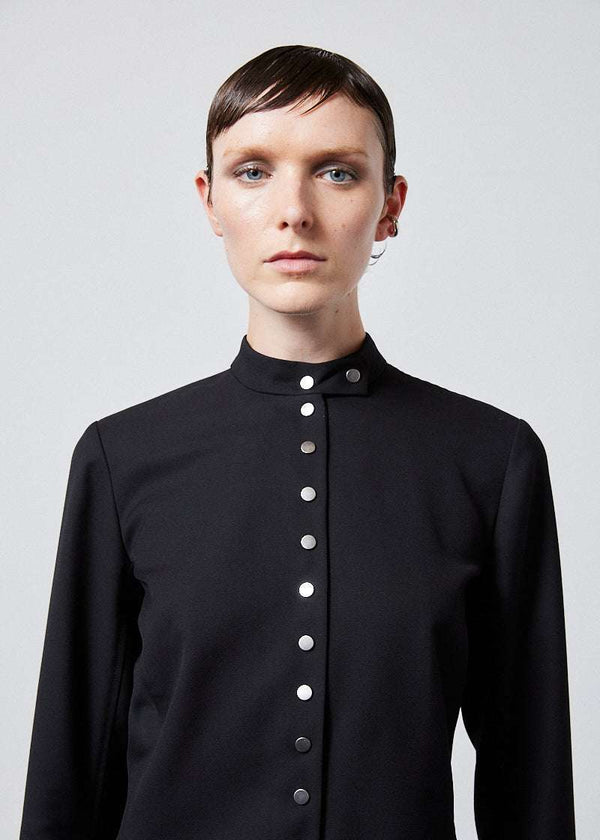 INTERNATIONAL CITIZEN.  Style: The Lunar Shacket is a slim jacket that wears like a shirt. It is lined with silver snaps down the front closure. Close up front photo. Made of Italian Wool RWS, Obsidian Black. Spiritually Infused, Sustainable Luxury Fashion in Berlin.