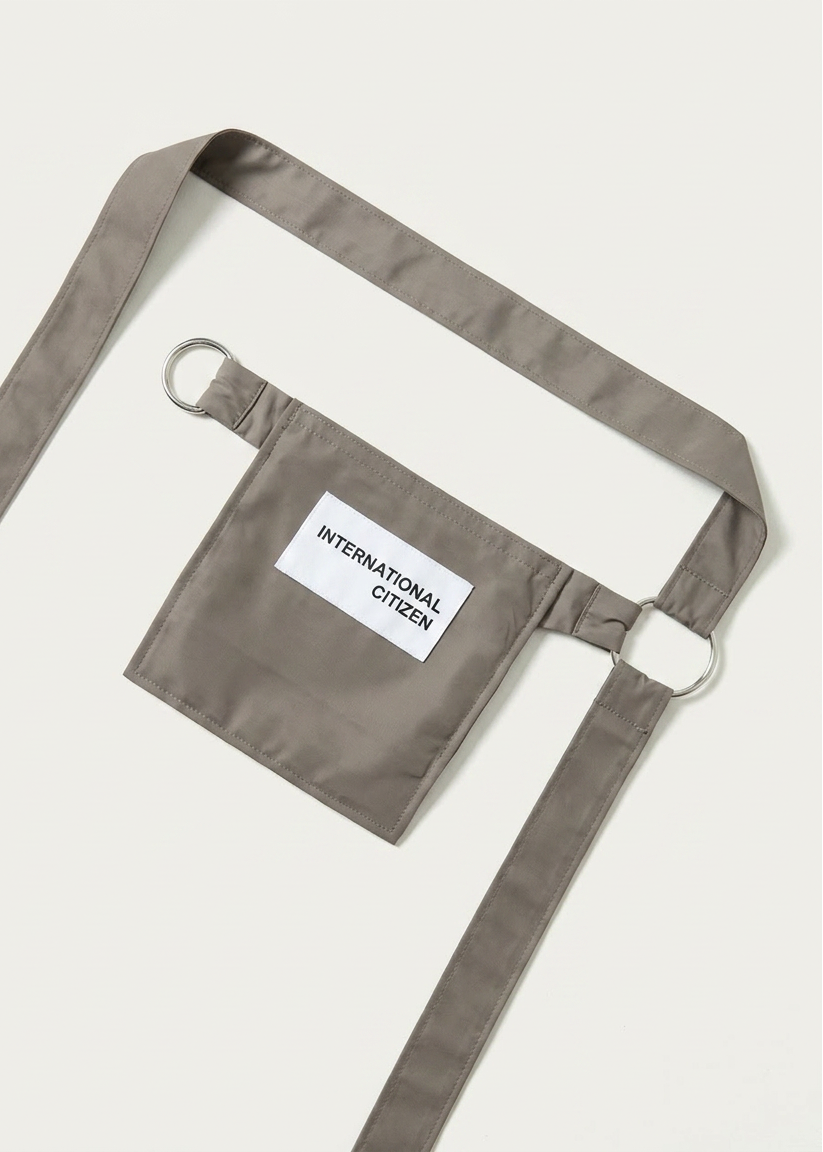 INTERNATIONAL CITIZEN.  Style: The M24 Cross Body Bag. Unisex Item. Made of Italian post-consumer recycled Nylon, Dune. Spiritually Infused, Sustainable Luxury Fashion in Berlin.
