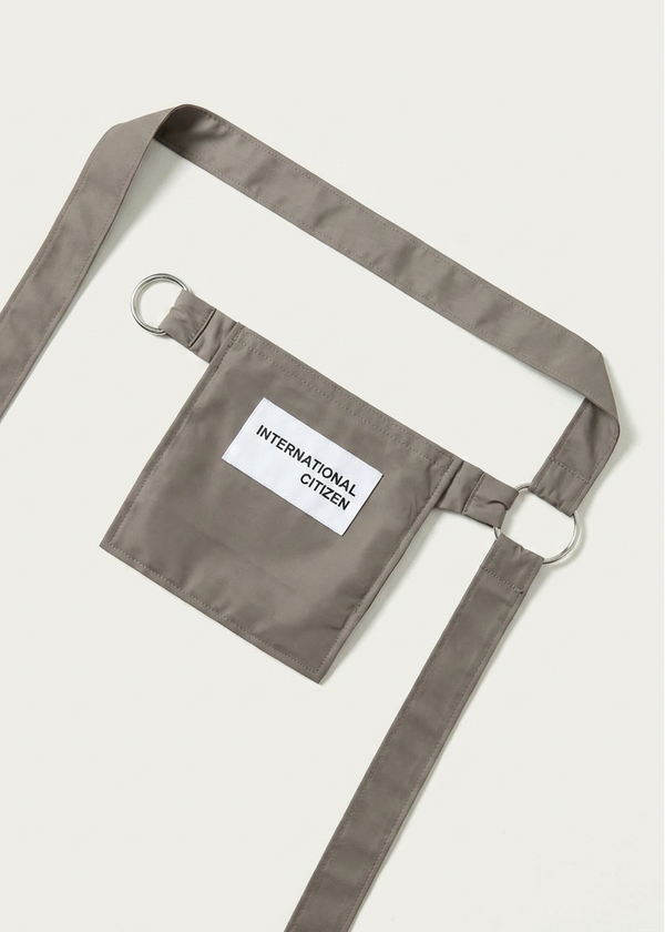 INTERNATIONAL CITIZEN.  Style: The M24 Cross Body Bag. Unisex Item. Made of Italian post-consumer recycled Nylon, Dune. Spiritually Infused, Sustainable Luxury Fashion in Berlin.
