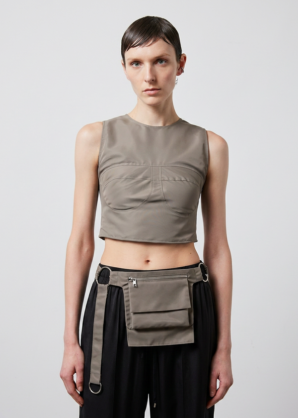 INTERNATIONAL CITIZEN.  Style: The M24 Cross Body Bag. Unisex Item. Full front model photo. Made of Italian post-consumer recycled Nylon, Dune. Spiritually Infused, Sustainable Luxury Fashion in Berlin.