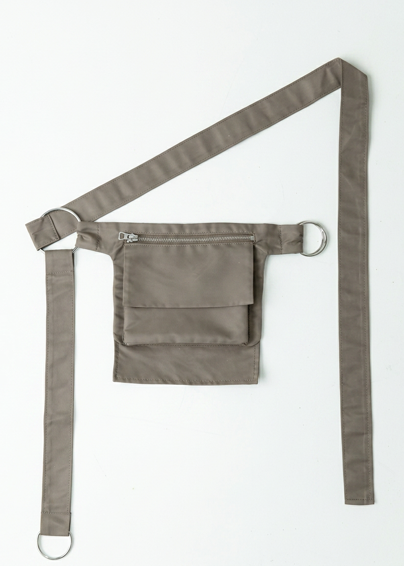 INTERNATIONAL CITIZEN.  Style: The M24 Cross Body Bag features a zipper welt pocket and patch pocket flap with adjustable ring straps. Unisex Item. Made of Italian post-consumer recycled Nylon, Dune. Spiritually Infused, Sustainable Luxury Fashion in Berlin.