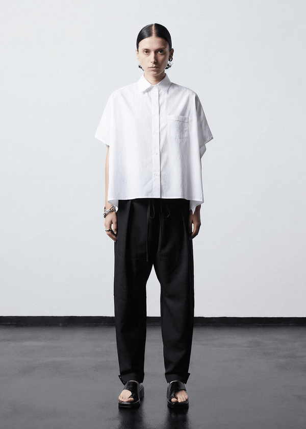 INTERNATIONAL CITIZEN.  Style: The Cubism Shirt is a 3-dimensional cube tilted on its axes to create a boxy minimal front body and a utility pen pocket on the chest. Unisex Item. Made of Italian Organic Cotton, White Quartz. Spiritually Infused, Sustainable Luxury Fashion in Berlin.