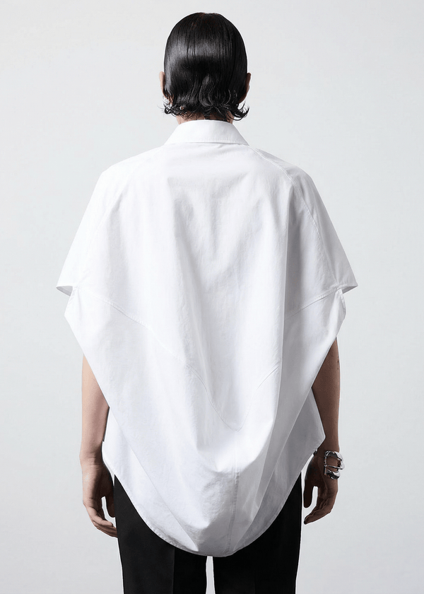 INTERNATIONAL CITIZEN.  Style: The Cubism Shirt is a 3-dimensional cube tilted on its axes to create drape in the back body. Back view close up. Unisex Item. Made of Italian Organic Cotton, White Quartz. Spiritually Infused, Sustainable Luxury Fashion in Berlin.