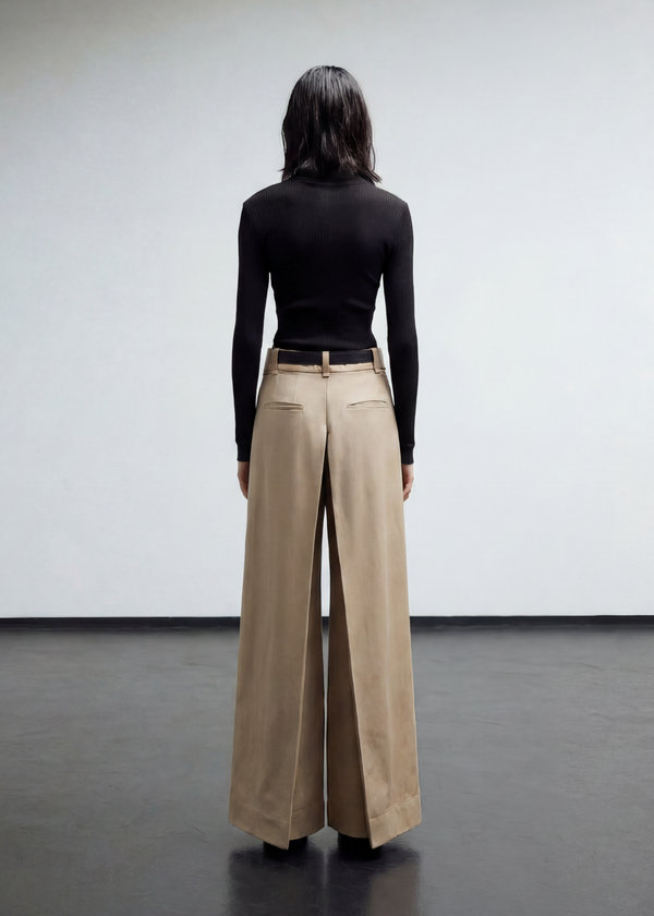 INTERNATIONAL CITIZEN.  Style: The Deep Pleated Pant, falls below the natural waist. The pleats meet at the center back. Made of Italian Organic Cotton, Dune. Spiritually Infused, Sustainable Luxury Fashion in Berlin.