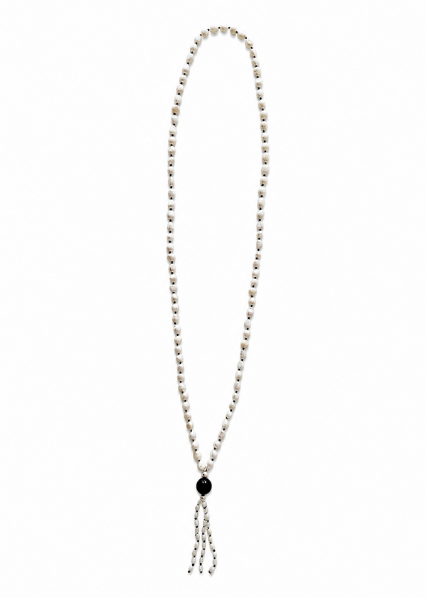 The Leuce Necklace energetically connects to the Crown Chakra. Made of genuine river pearls and obsidian center bead.