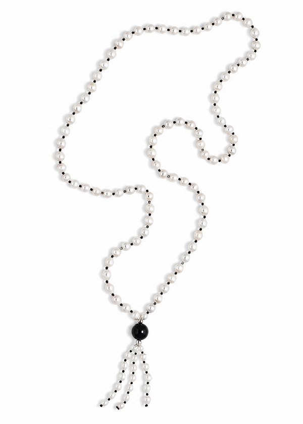 The Leuce Necklace energetically connects to the Crown Chakra. Made of genuine river pearls and obsidian center bead & tassle.