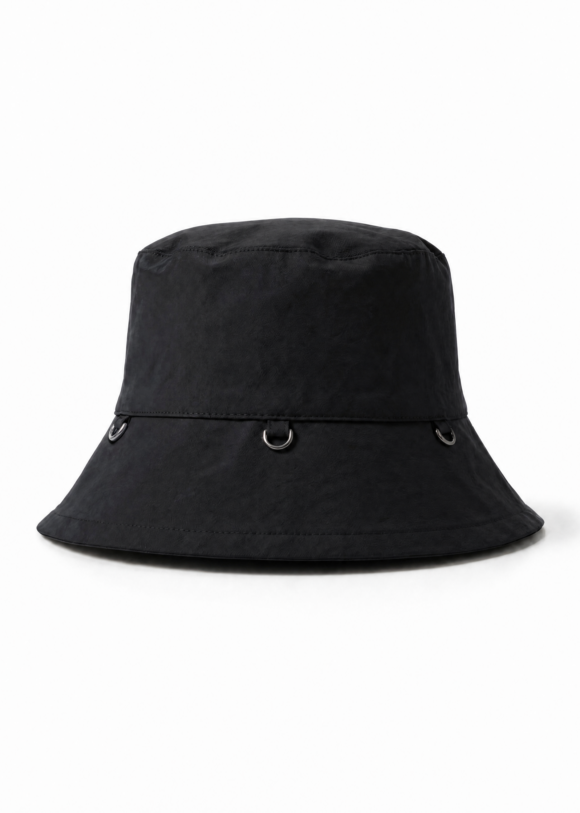 INTERNATIONAL CITIZEN.  Style: The Charm Bucket Hat. Front view. A unisex hat with utility details that feature our signature silver ring at the back and mini rings around the rim to clip your charms. Made of Italian post-consumer recycled Nylon, Obsidian Black. Spiritually Infused, Sustainable Luxury Fashion in Berlin.