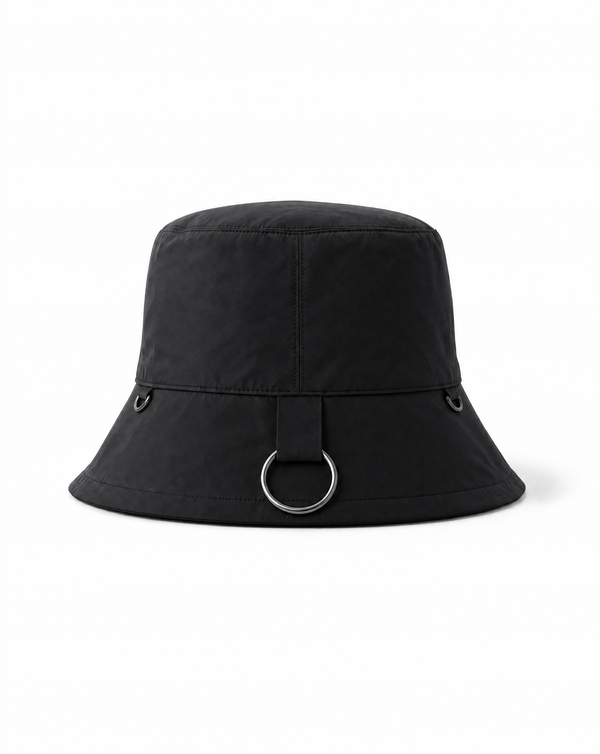 INTERNATIONAL CITIZEN.  Style: The Charm Bucket Hat. Back view. A unisex hat with utility details that feature our signature silver ring at the back and mini rings around the rim to clip your charms. Made of Italian post-consumer recycled Nylon, Obsidian Black. Spiritually Infused, Sustainable Luxury Fashion in Berlin.