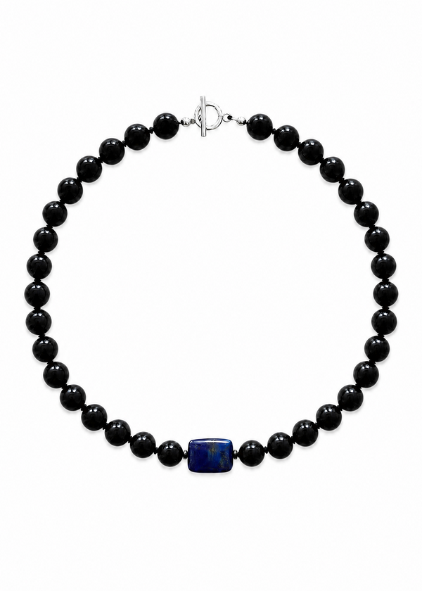 INTERNATIONAL CITIZEN: The Lazuli Necklace is made of obsidian beads with a lapis lazuli stone at the center, which energetically connects to the root chakra. Each obsidian stone is 12mm and the lapis lazuli stone is 20mm x 15mm.