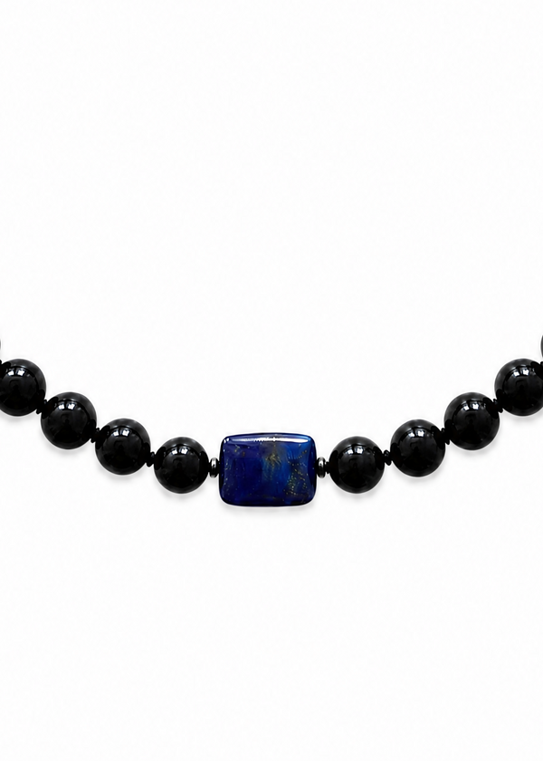 INTERNATIONAL CITIZEN: The Lazuli Necklace is made of obsidian beads with a lapis lazuli stone at the center. Each obsidian stone is 12mm and the lapis lazuli stone is 20mm x 15mm.