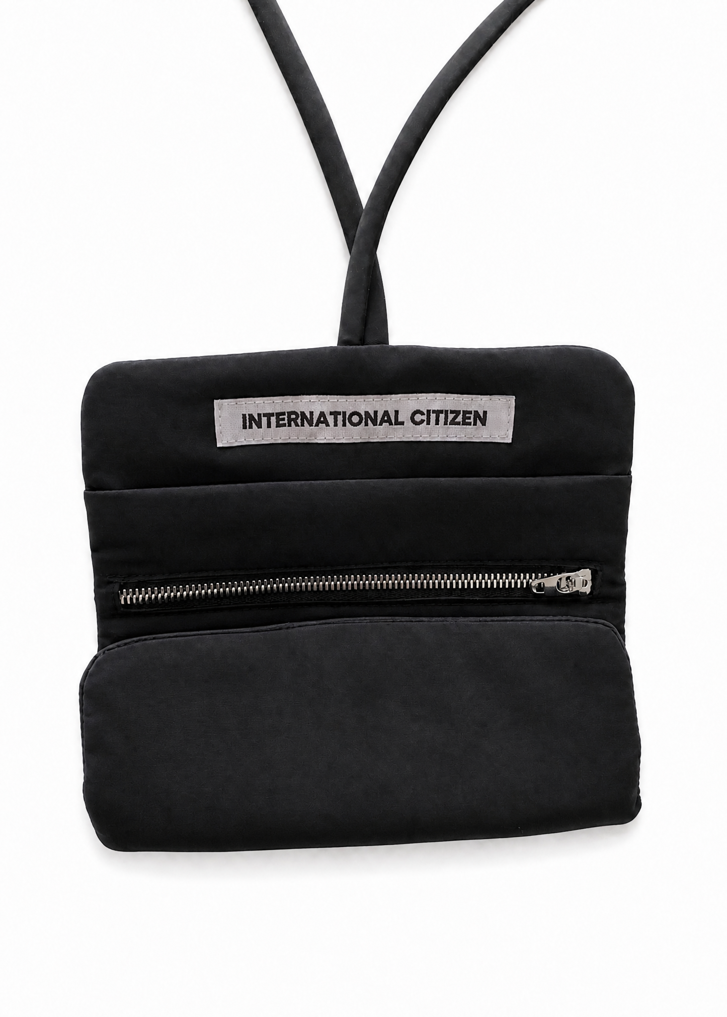INTERNATIONAL CITIZEN: The Jewel Travel Bag is made of water repellent reNylon Gabardine. Shown Folded half way.