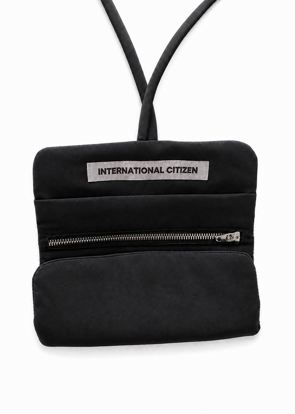 INTERNATIONAL CITIZEN: The Jewel Travel Bag is made of water repellent reNylon Gabardine. Shown Folded half way.