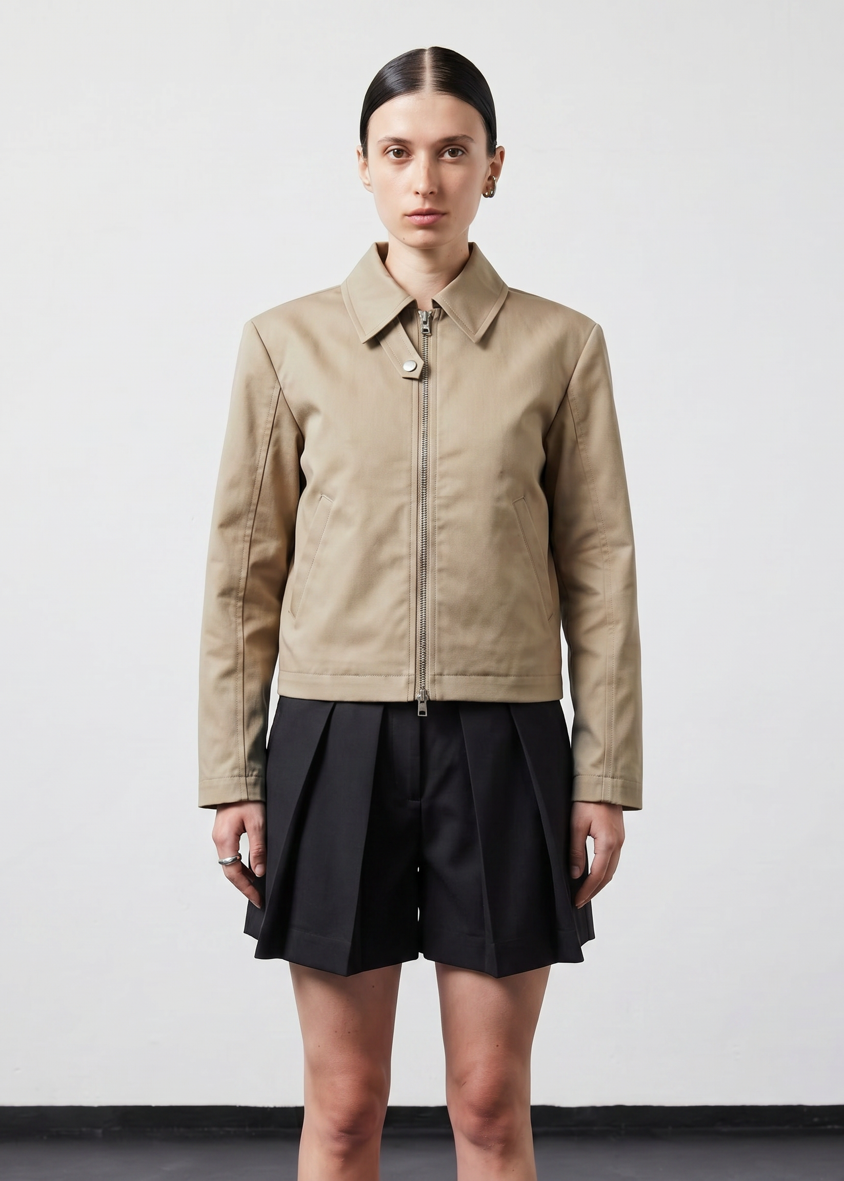INTERNATIONAL CITIZEN.  Style: Ajna Jacket. A black boxy jacket with sporty tailoring, featuring square shoulders, tapered sleeves. The jacket is made from of Italian Organic Cotton Twill, Dune. Spiritually Infused, Sustainable Luxury Fashion in Berlin.