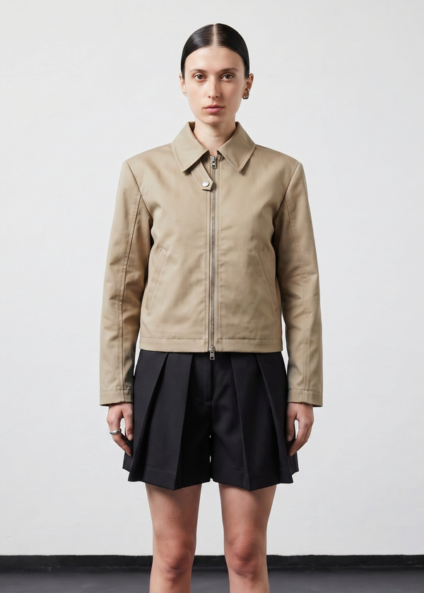 INTERNATIONAL CITIZEN.  Style: Ajna Jacket. A black boxy jacket with sporty tailoring, featuring square shoulders, tapered sleeves. The jacket is made from of Italian Organic Cotton Twill, Dune. Spiritually Infused, Sustainable Luxury Fashion in Berlin.