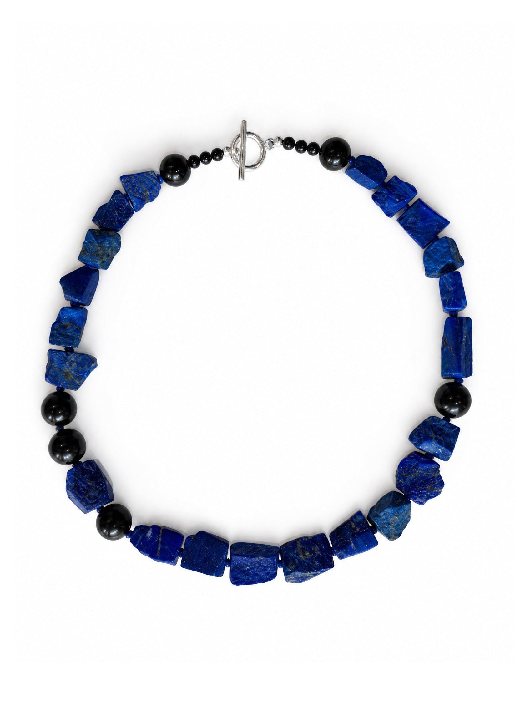 The Nuit Necklace energetically connects to the Third Eye Chakra. The energy center in located at between the eyes. It represents spiritual intuition, perception and spiritual insight, serving as a gateway to higher consciousness and inner wisdom. Made of genuine Lapis Lazuli &amp; Obsidian.