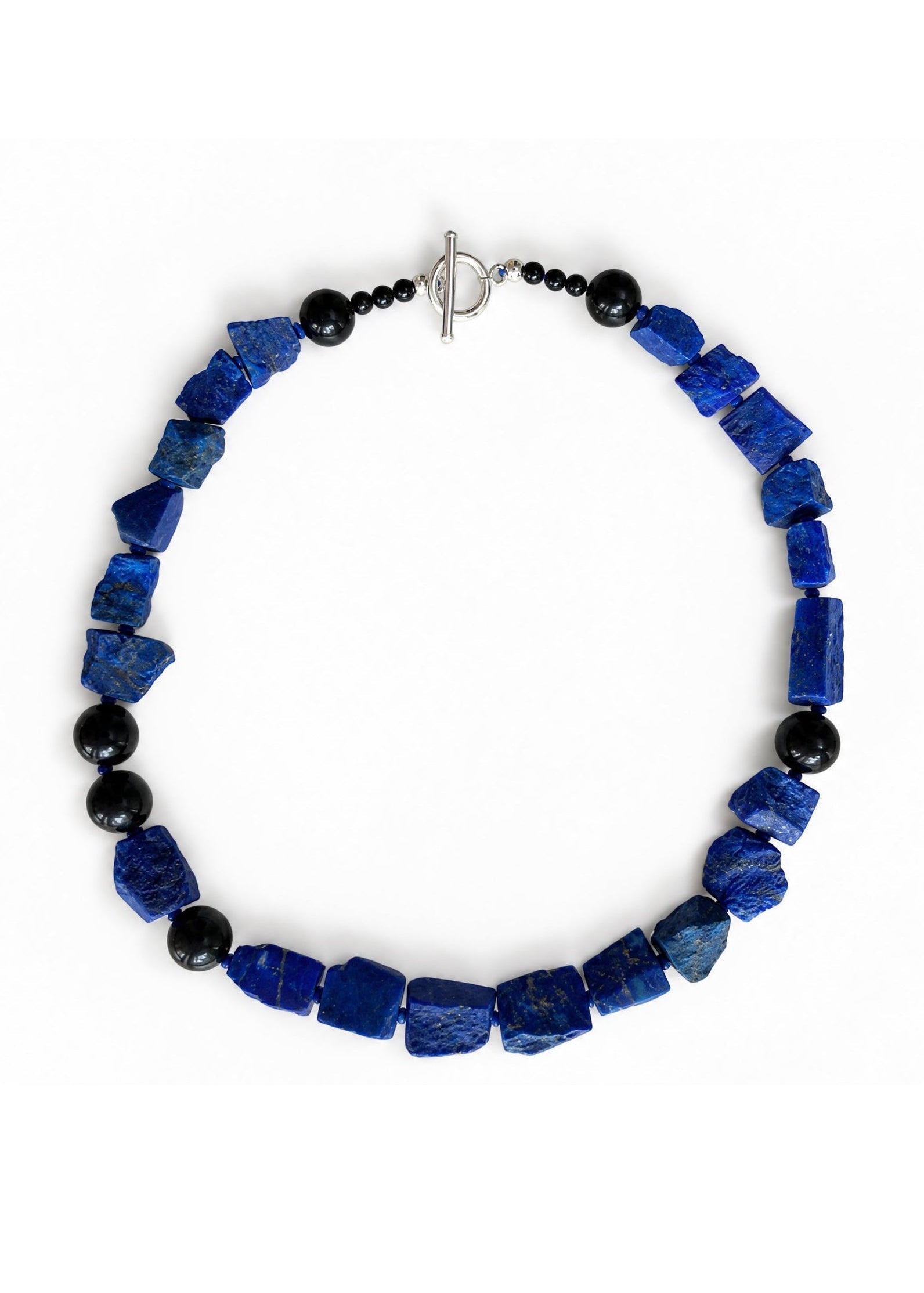 The Nuit Necklace energetically connects to the Third Eye Chakra.  Made of genuine Lapis Lazuli &amp; Obsidian.