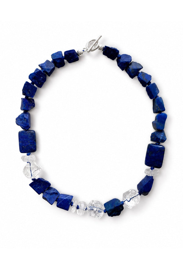 The Calypso Necklace energetically connects to the Third Eye Chakra, made of lapis lazuli and clear quartz.