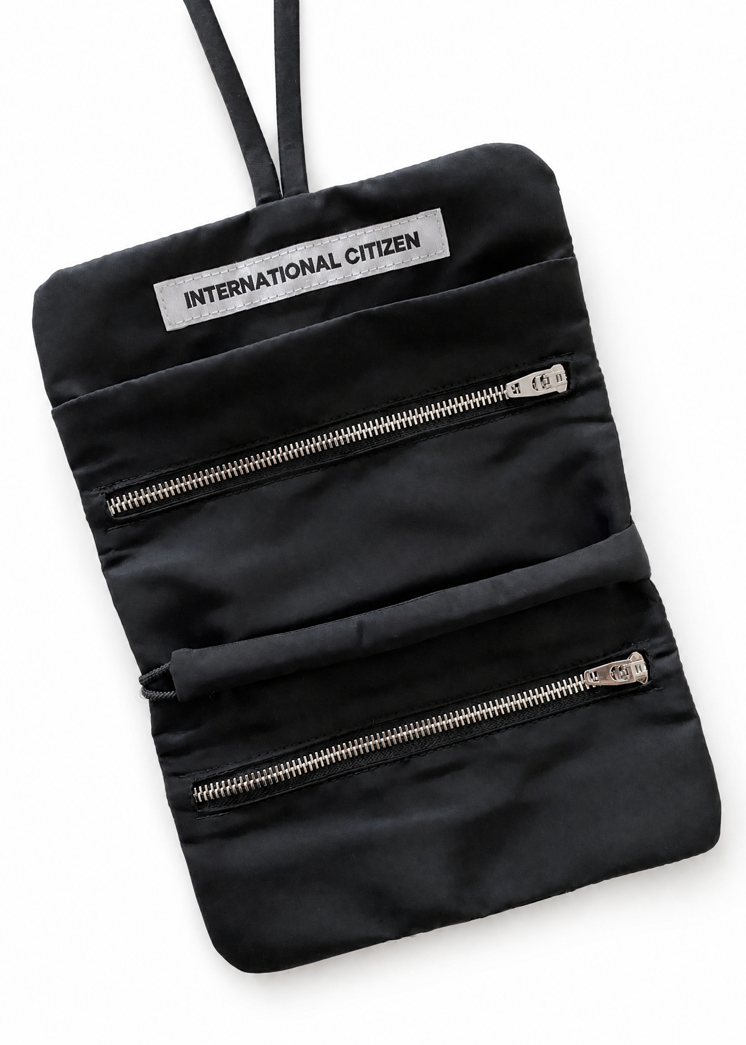 The Jewel Travel Bag is made of water repellent reNylon Gabardine. It features a zipper welt pocket to store you jewelry that folds and ties for closure.
Unisex Item.
