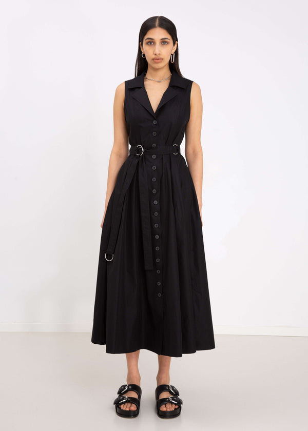 INTERNATIONAL CITIZEN.  Style: Button Dress. Front photo. A Button Dress with princess seams that open to box pleats below the hips. Detachable belt with silver ring details for closure. The dress is made of Italian organic Cotton in Obsidian Black. Spiritually Infused, Sustainable Luxury Fashion in Berlin.