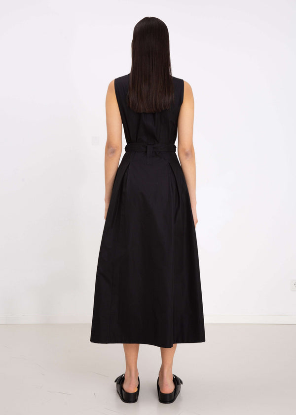 INTERNATIONAL CITIZEN.  Style: Button Dress. Black body view. A Button Dress with princess seams that open to box pleats below the hips. Detachable belt with silver ring details for closure. The dress is made of Italian organic Cotton in Obsidian Black. Spiritually Infused, Sustainable Luxury Fashion in Berlin.