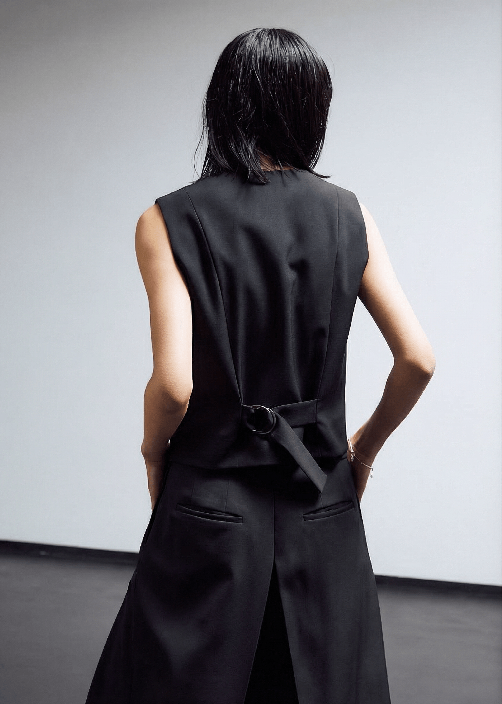 INTERNATIONAL CITIZEN.  Style: The Tarot Vest is a classic vest. Back view. Made of Italian Wool RWS, Obsidian Black. Spiritually Infused, Sustainable Luxury Fashion in Berlin.