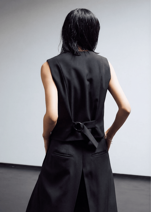 INTERNATIONAL CITIZEN.  Style: The Tarot Vest is a classic vest. Back view. Made of Italian Wool RWS, Obsidian Black. Spiritually Infused, Sustainable Luxury Fashion in Berlin.