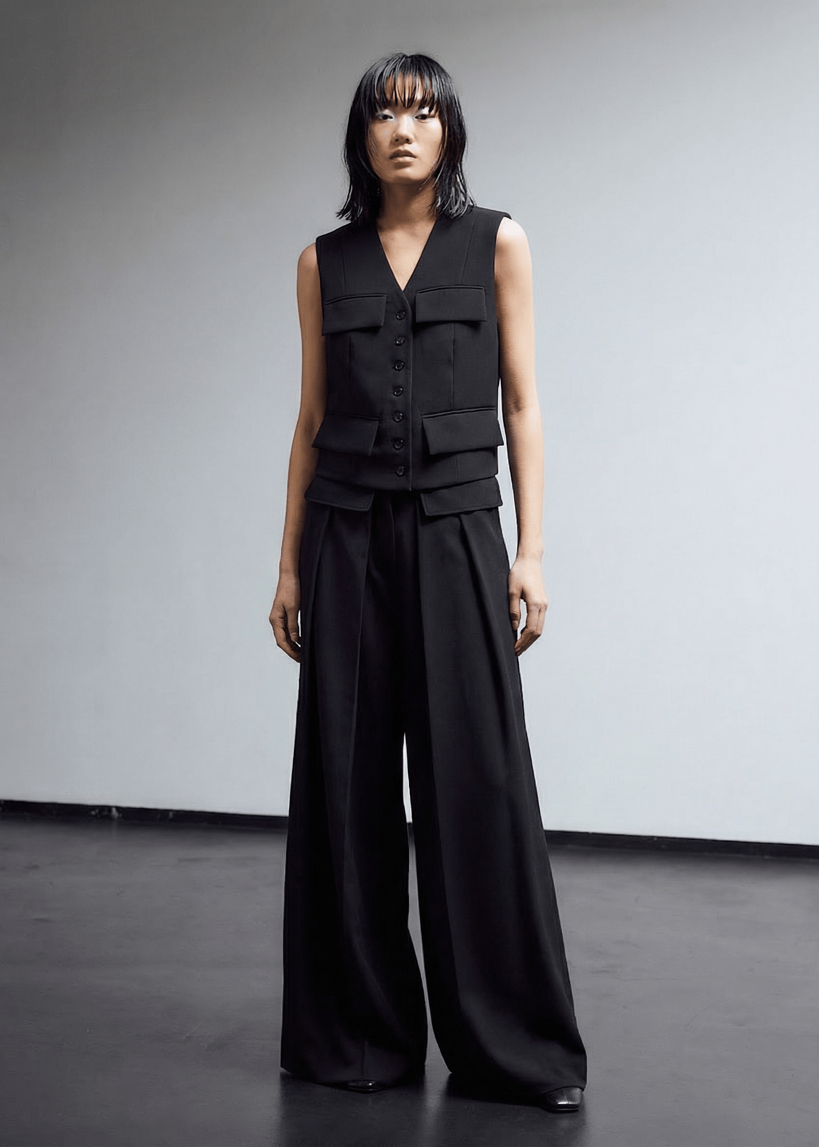 INTERNATIONAL CITIZEN.  Style: The Tarot Vest is a classic vest. Full frontal view. Made of Italian Wool RWS, Obsidian Black. Spiritually Infused, Sustainable Luxury Fashion in Berlin.