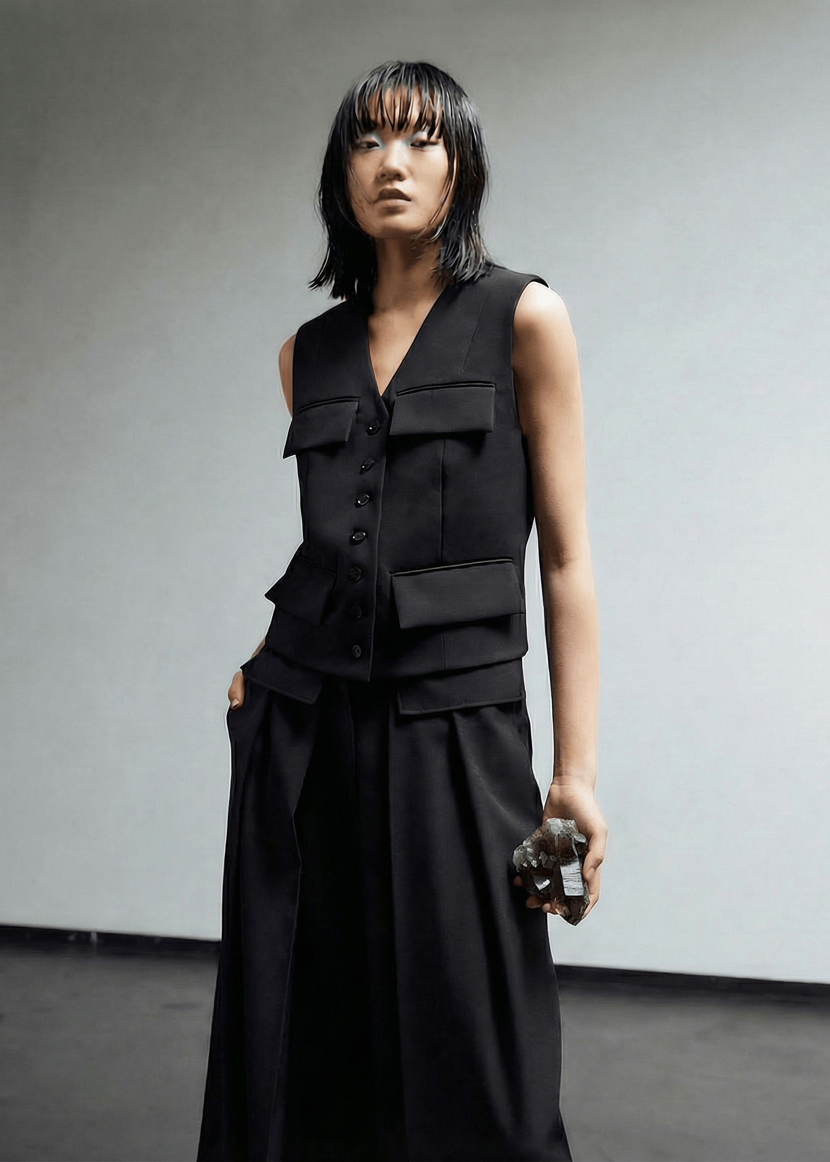 INTERNATIONAL CITIZEN.  Style: The Tarot Vest is a classic vest with exposed hem pocket bags and 7-Chakra button closure down the front. Made of Italian Wool RWS, Obsidian Black. Spiritually Infused, Sustainable Luxury Fashion in Berlin.