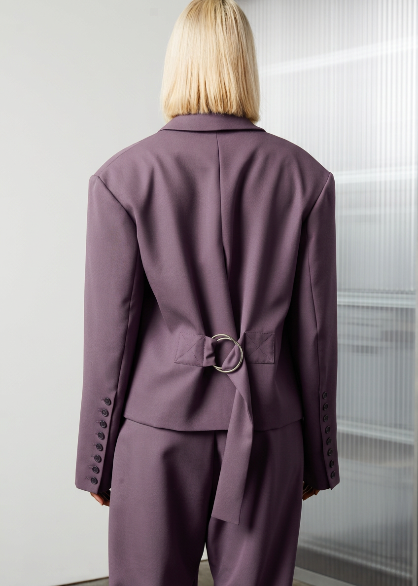 The Oversized Men’s Jacket features classic mens tailoring details within the inner construction with an oversized shape. Back view. Made of wool. Unisex item.