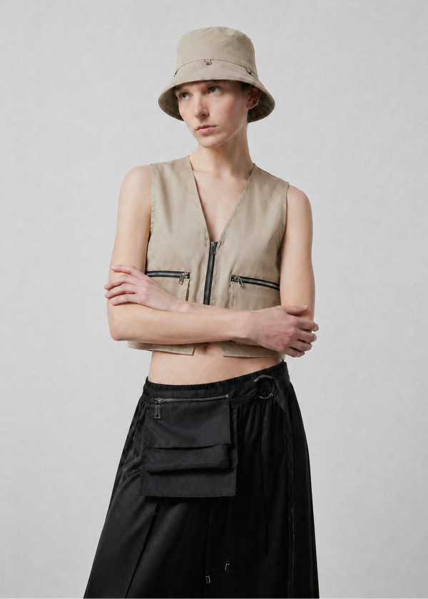 INTERNATIONAL CITIZEN.  Style: The Charm Bucket Hat. Front view. A unisex hat. Made of Italian Organic Cotton Twill, Dune. Spiritually Infused, Sustainable Luxury Fashion in Berlin.